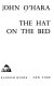 The hat on the bed /